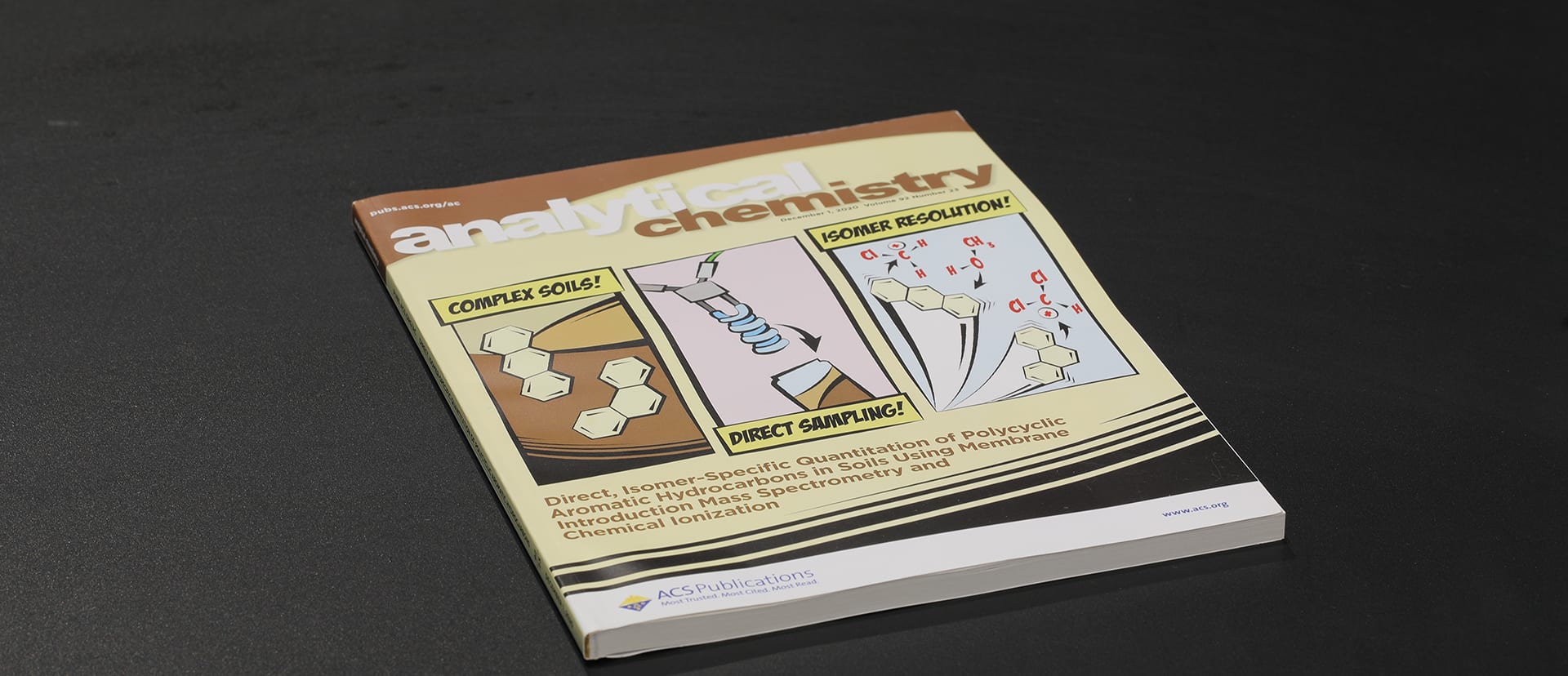 A printed issue of Analytical Chemistry on a dark tabletop