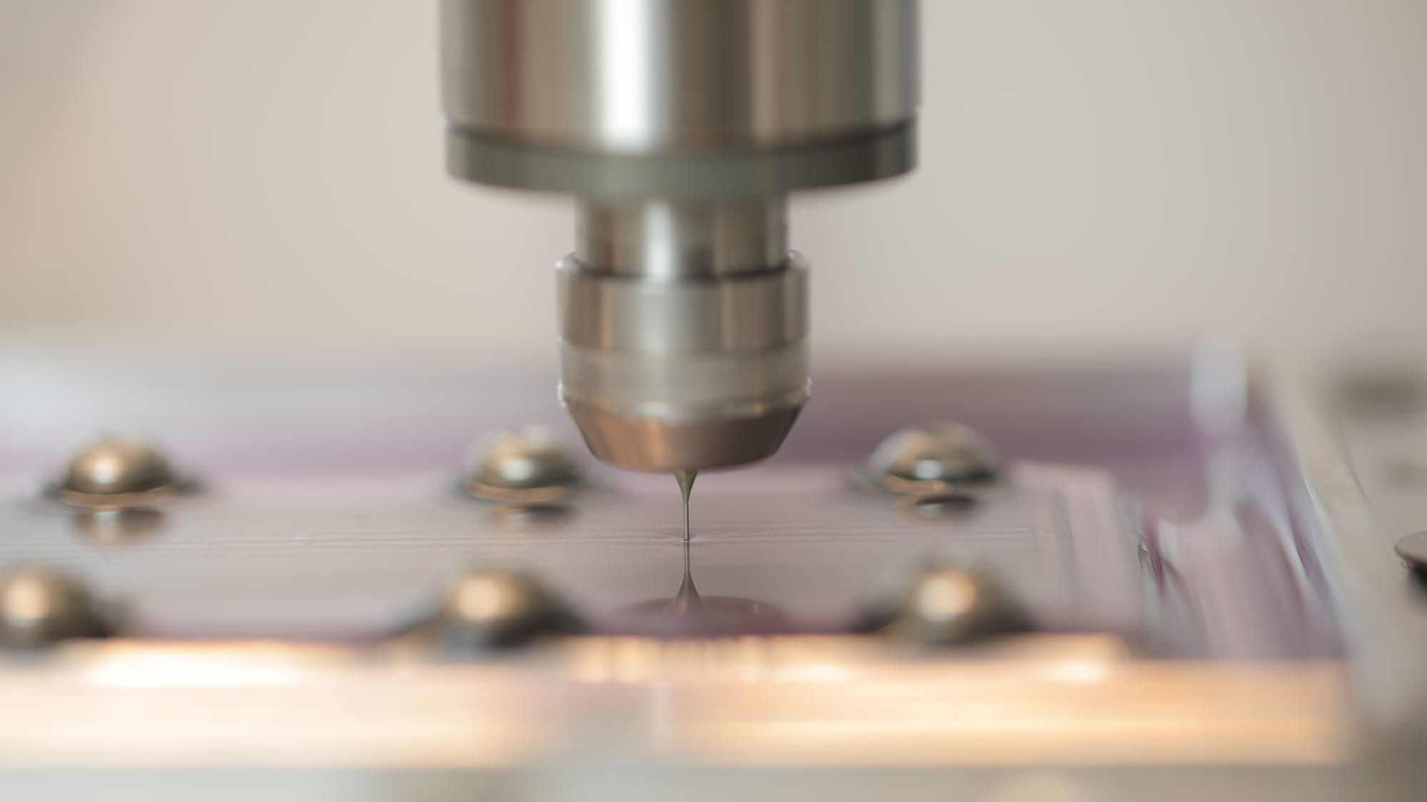 Micro end mill cutting channels into a plate held on a fixture