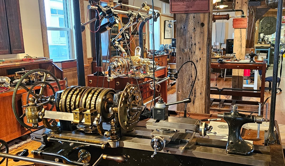 A restored antique rose engine on the Plumier Workshop floor