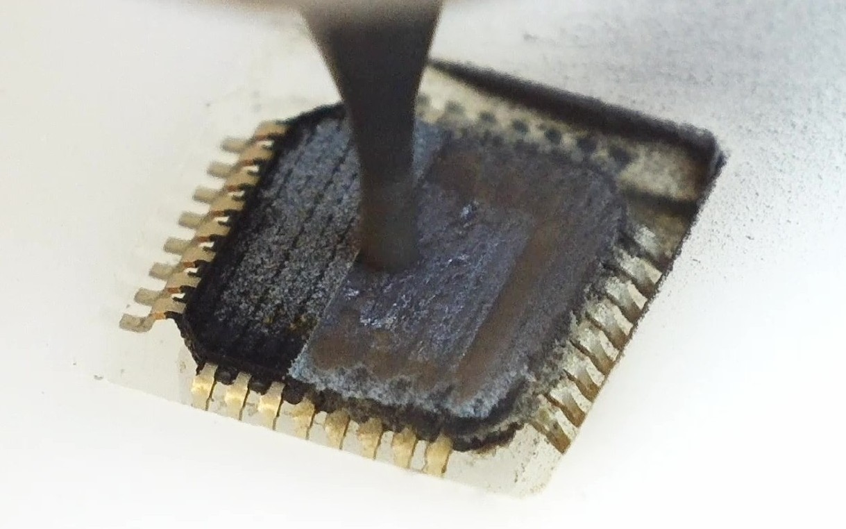 Stepped pocket milled into a microchip package, exposing the layers below the surface