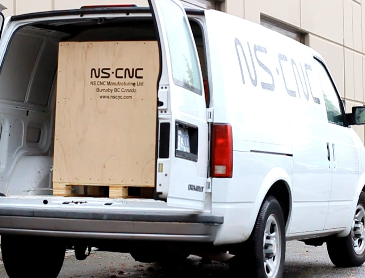 An NS CNC van with a crated machine loaded for delivery