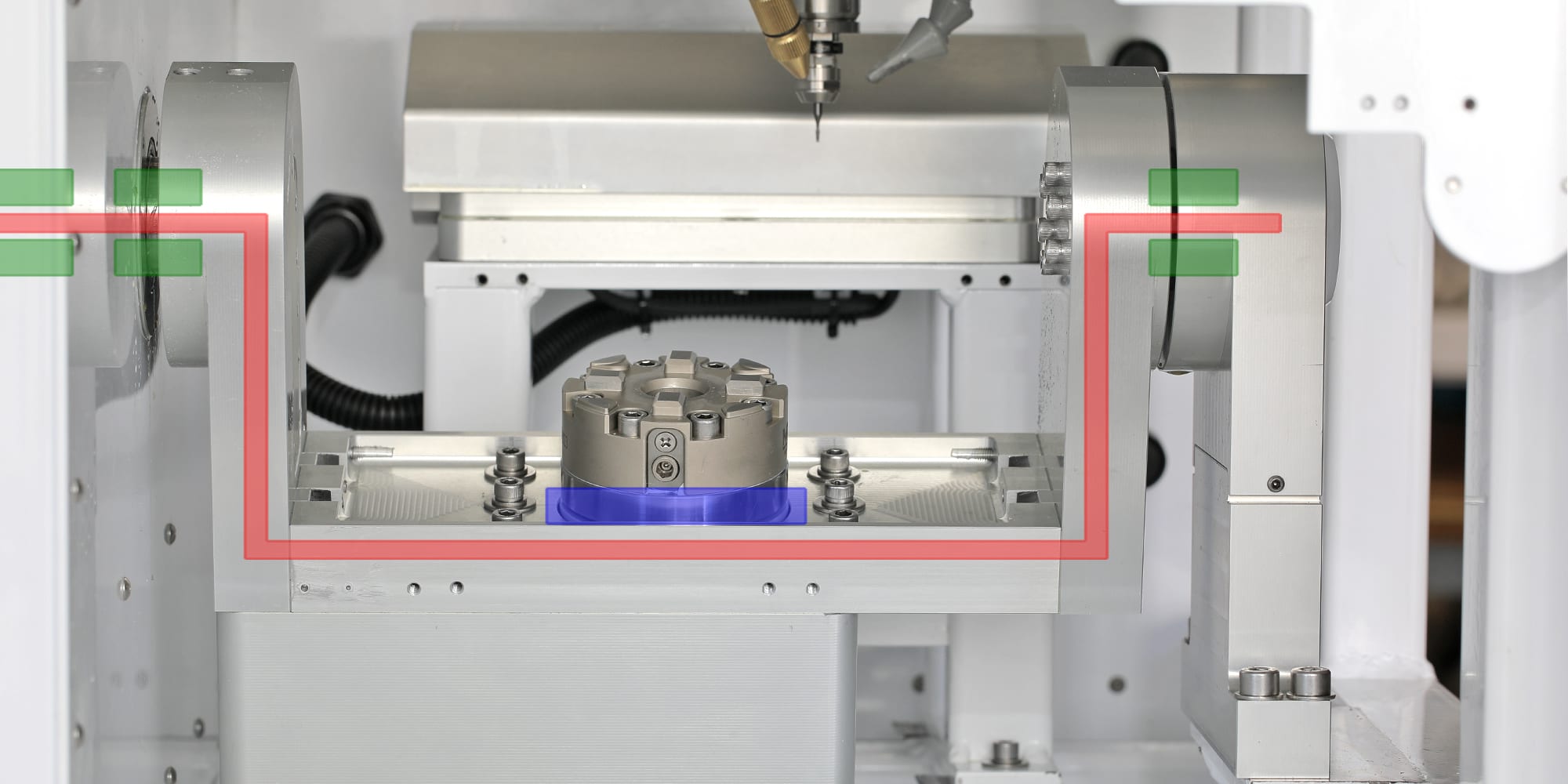 Front view of the dual-bearing rotary head: both A-axis bearing housings, the B platter with the QRS chuck, and the spindle nose on the alignment centerline