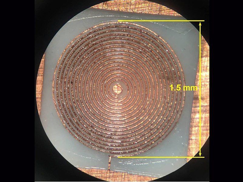 16-turn spiral microcoil milled from copper-coated Teflon