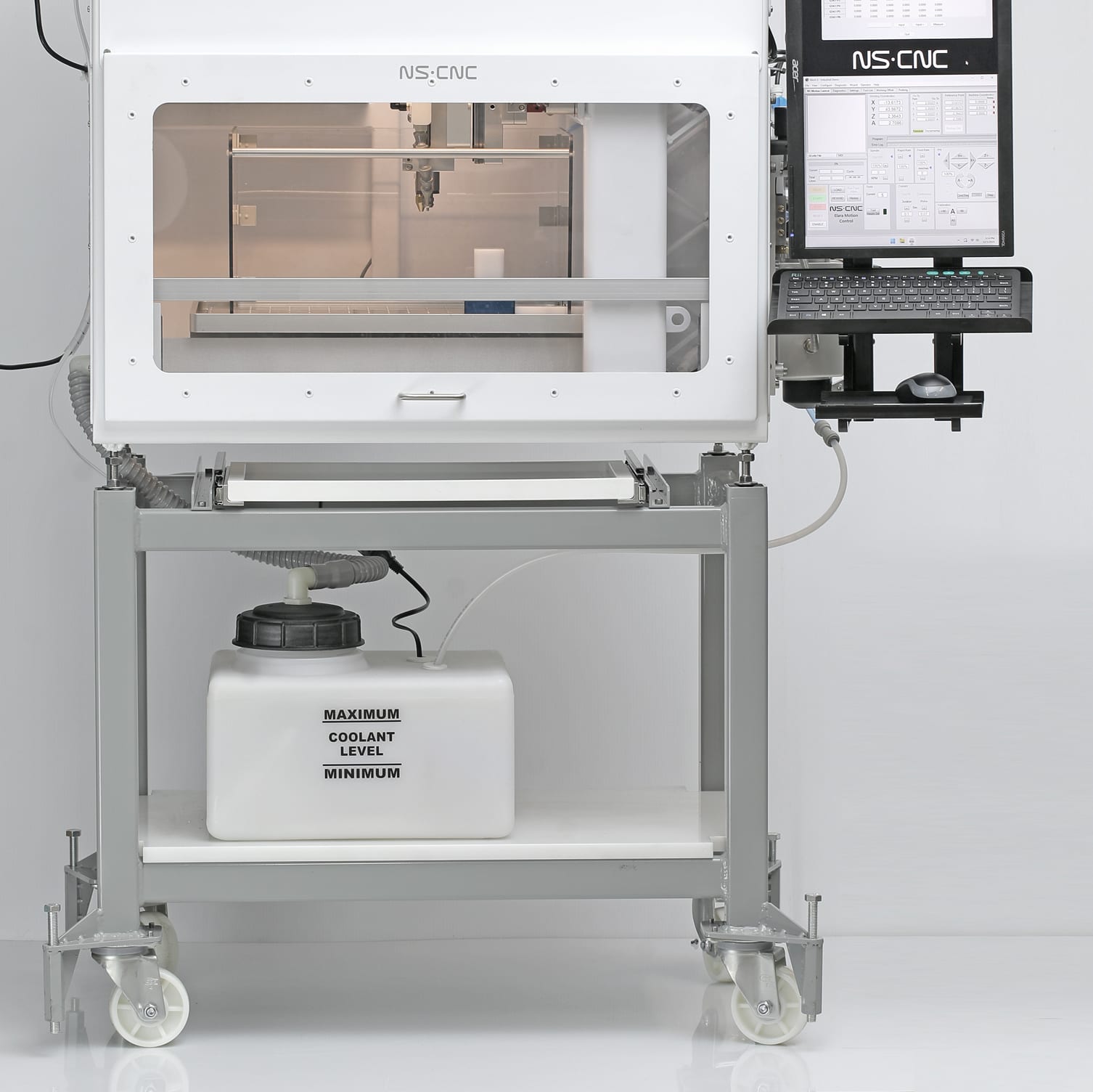 The Elara 2 on its machine stand: pull-out tray under the machine, coolant tank with level markings on the lower shelf, heavy-duty casters with leveling screws, and the keyboard and monitor arm at right