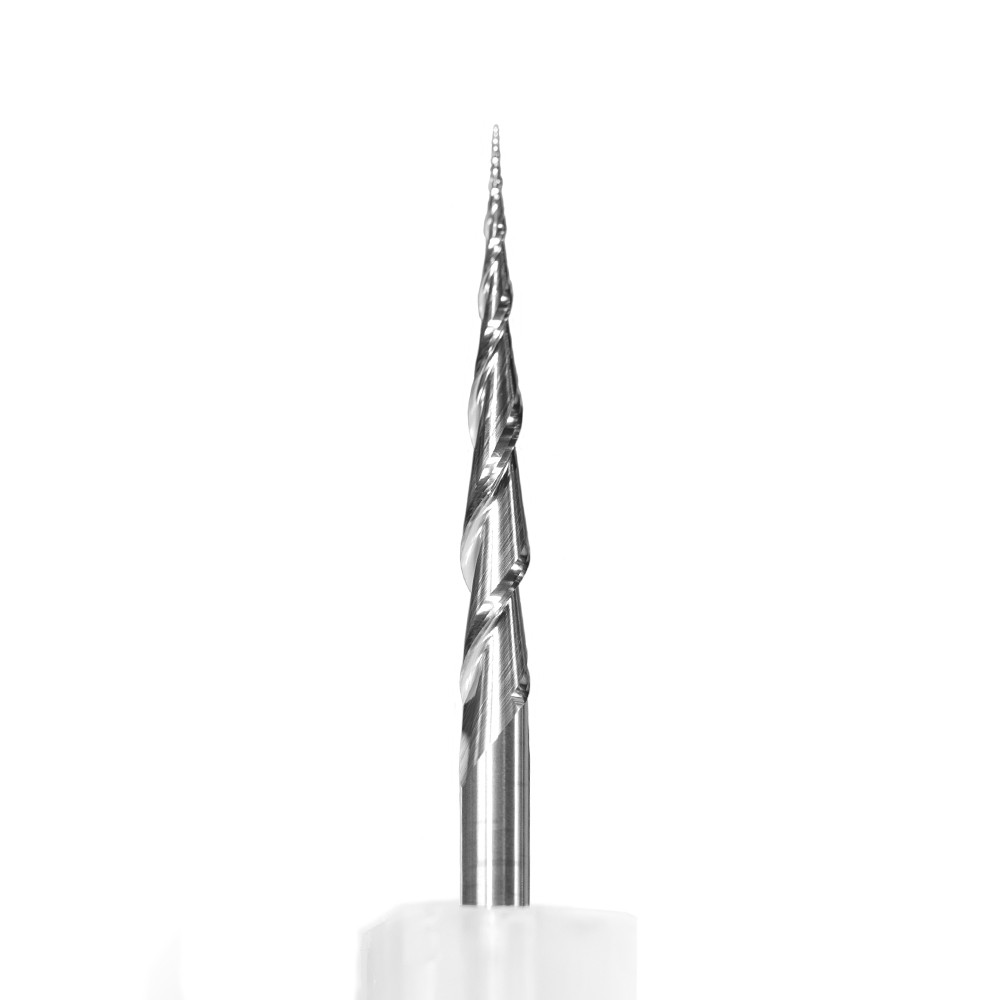 The Mira-Bit: a tapered solid carbide cutter standing in its case